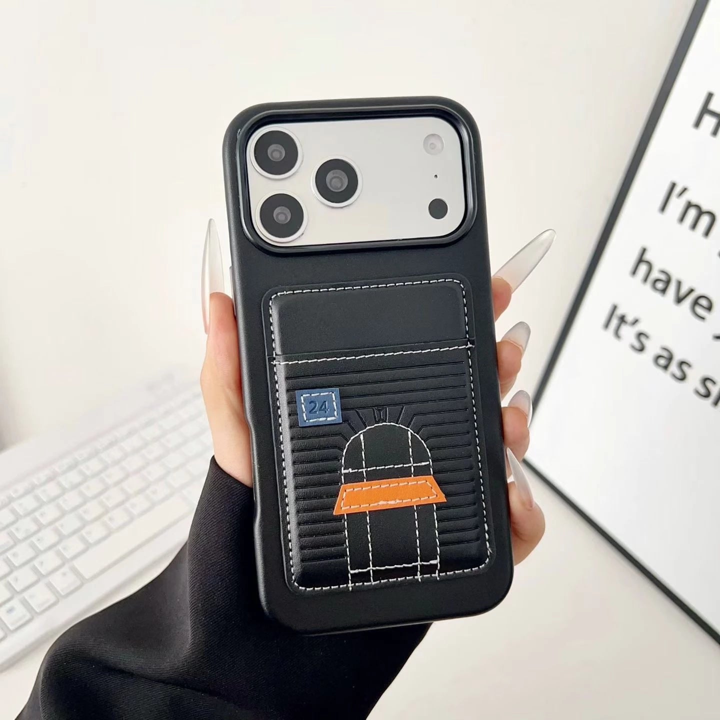 Black Hermes iPhone 17 Pro Max case with cardholder