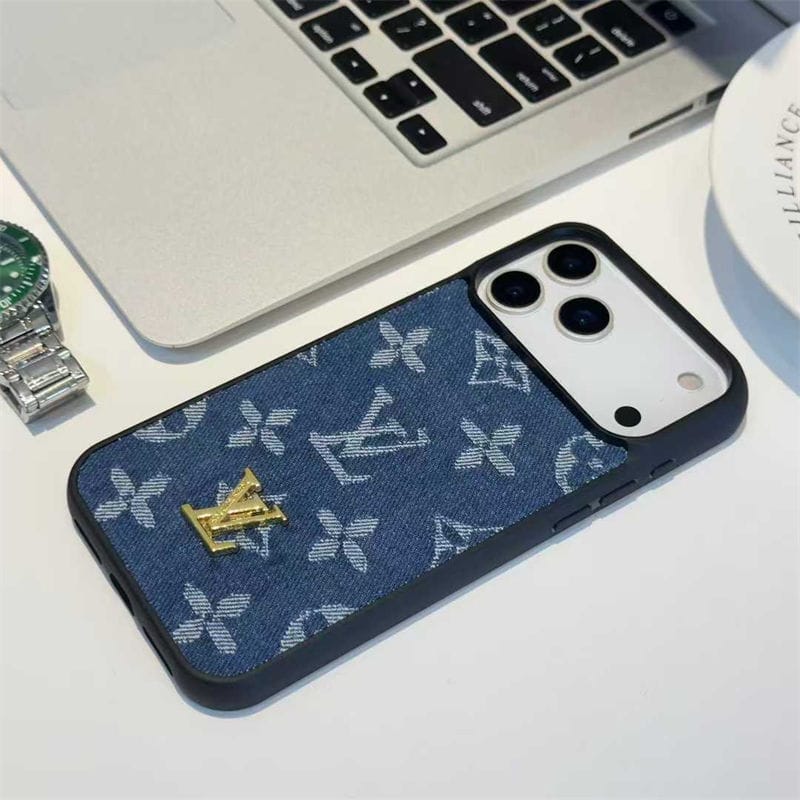 Phone case with brand logo on a desk with laptop and watch