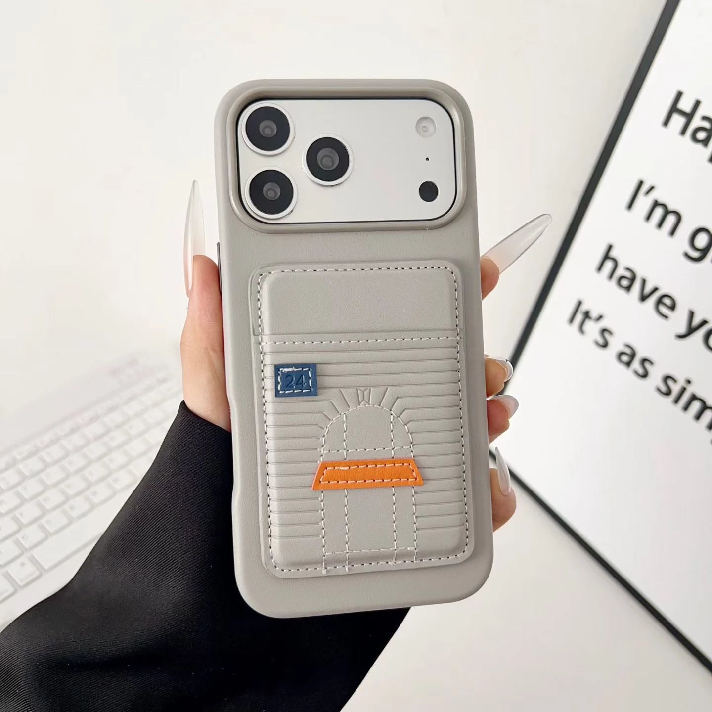 Silver Hermes iPhone 17 Pro Max case with cardholder